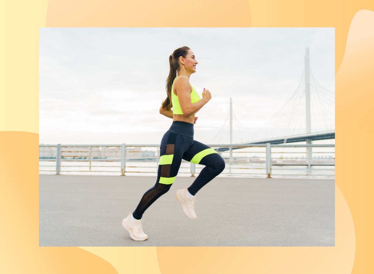 fit brunette woman running outdoors near water and bridge