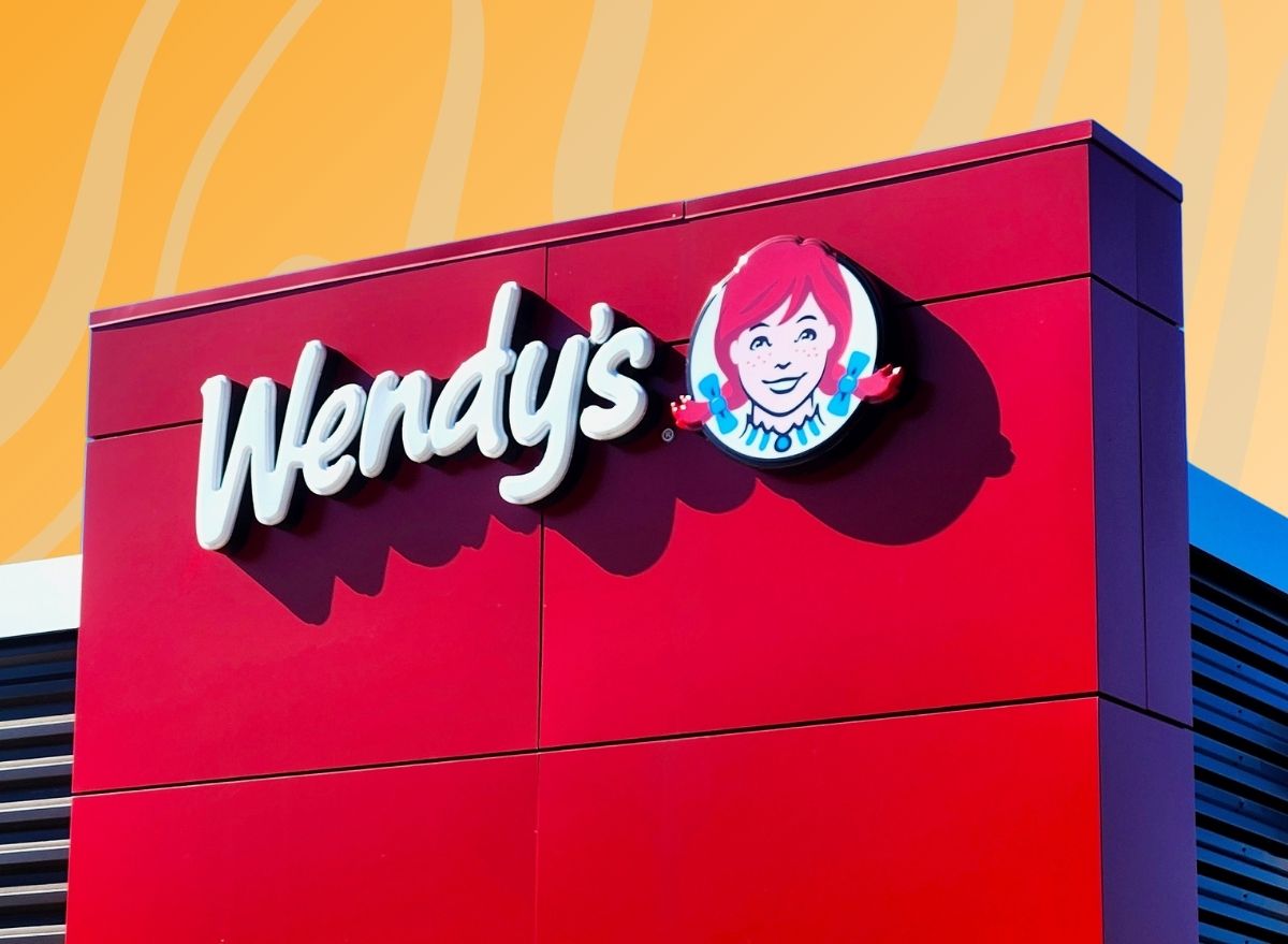 Wendy's exterior against colorful orange yellow background