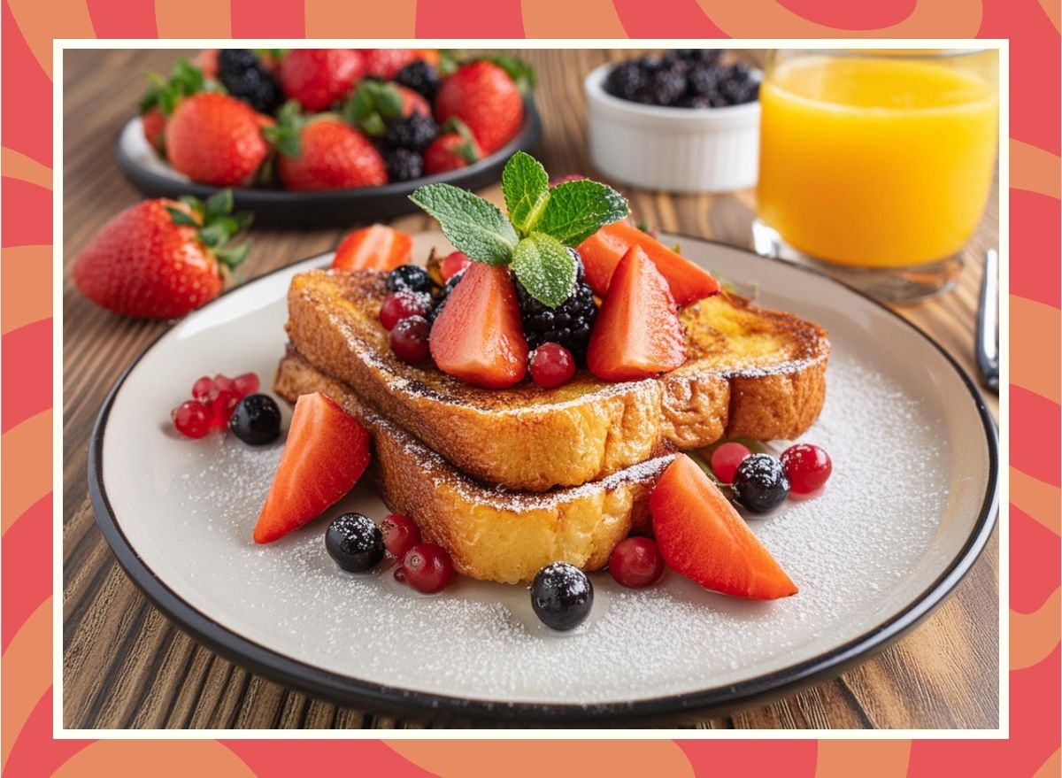 a photo of a plate of french toast topped with berries