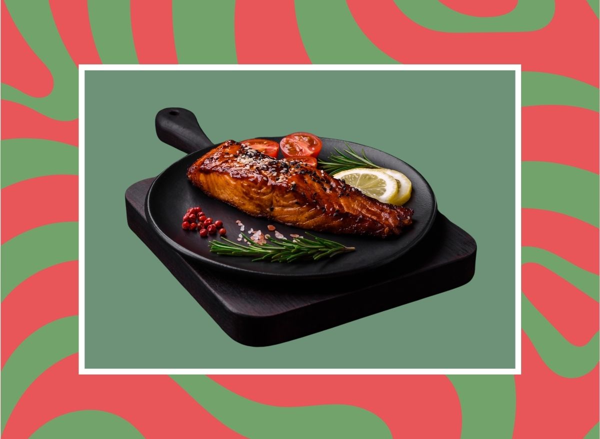 a photo of festive plate of salmon on a designed holiday-themed background