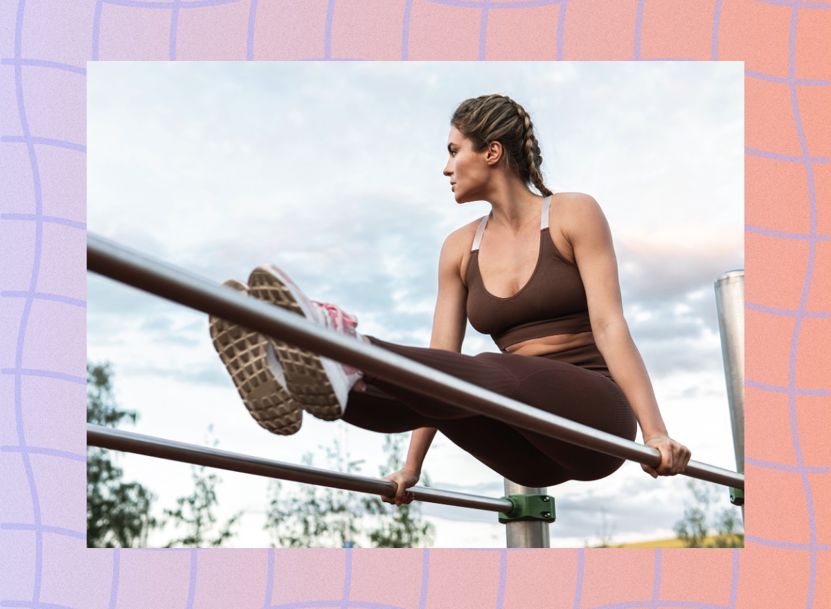 determined woman doing leg raises outdoors