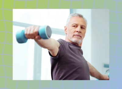 fit, mature man focused while doing a dumbbell lateral raise exercise