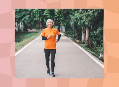 happy, mature woman walking briskly outdoors for exercise