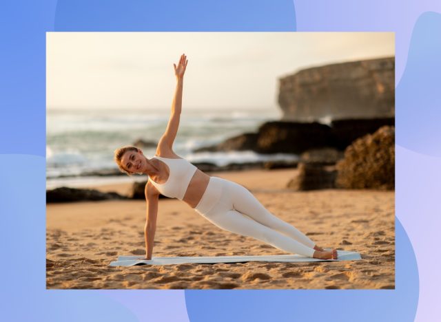 fit woman doing side plank exercise on the beach