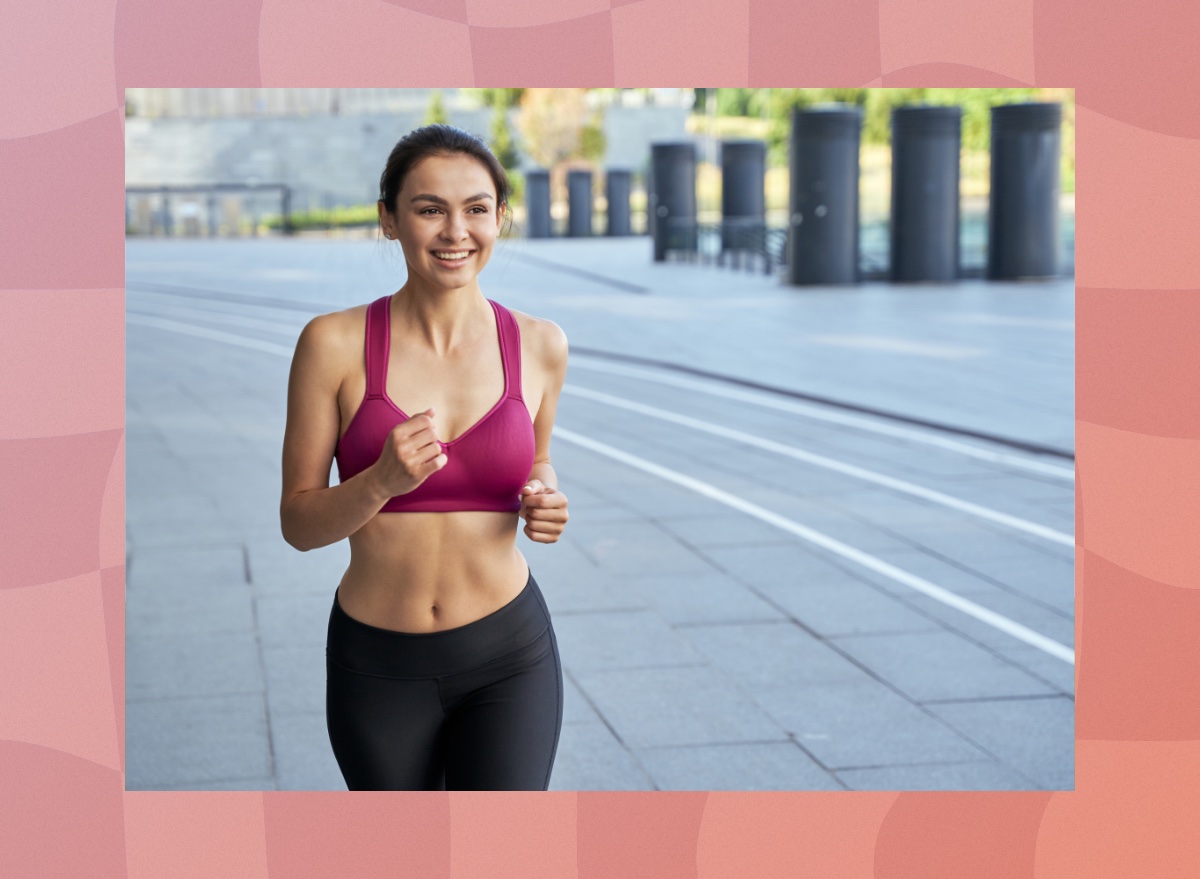 fit, happy brunette woman running outdoors