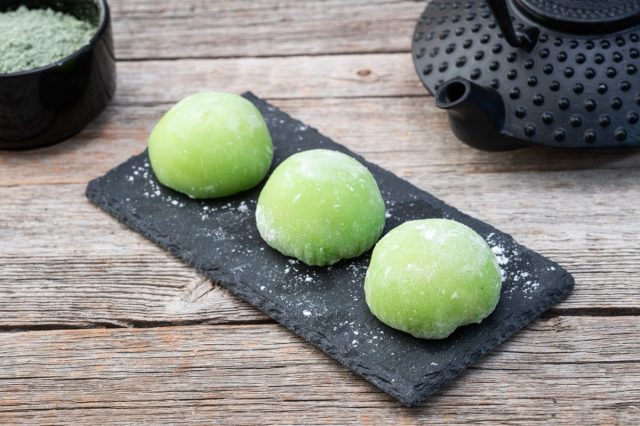 Traditional japanese desert mochi with matcha latte tea.