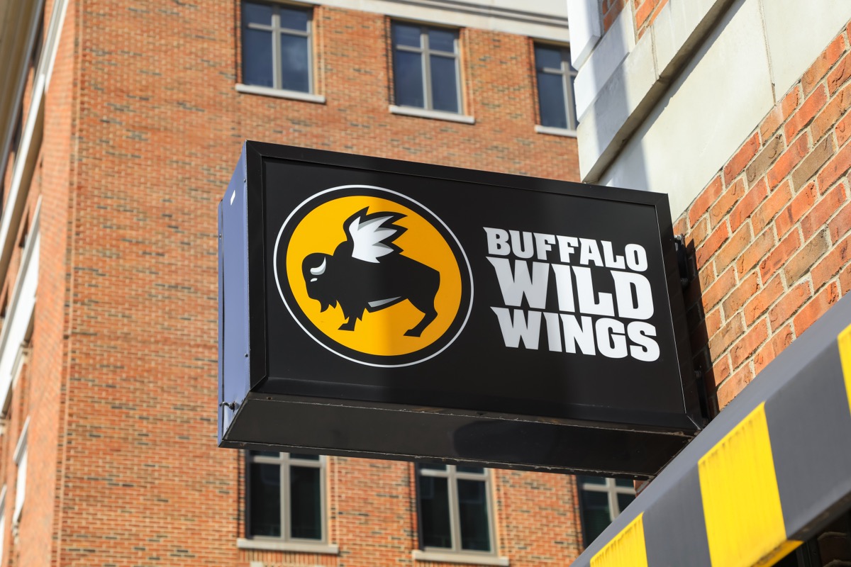 ANN ARBOR, MI - AUGUST 09,2020: Buffalo Wild Wings store sign, Buffalo Wild wings is an American dining restaurant and sports bar franchise in the United States, Canada, India and many countries.