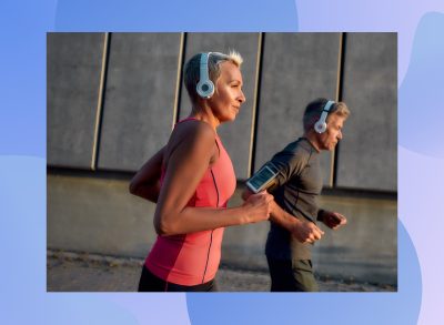 fit, focused mature woman running outdoors