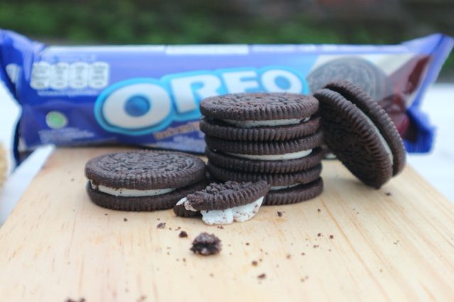 Jember, Indonesia - April 29 2024: Oreo Cookies on wooden background. Oreo Crumbs. Vanilla oreo.