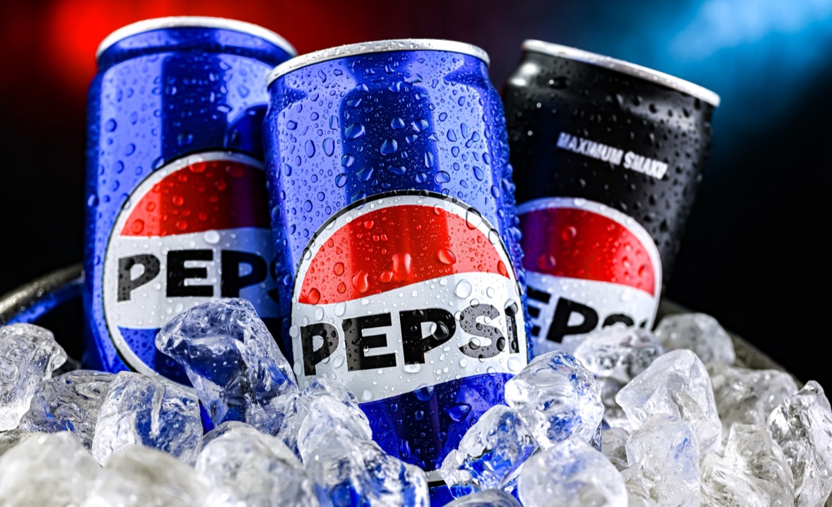 POZNAN, POL - AUG 7, 2024: Cans of Pepsi, a carbonated soft drink produced and manufactured by PepsiCo. The beverage was created and developed in 1893 under the name Brad's Drink