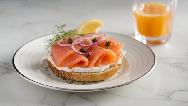 Smoked Salmon Bagel: Toasted bagel topped with smoked salmon, cream cheese, capers, and red onions. A classic and elegant breakfast option.