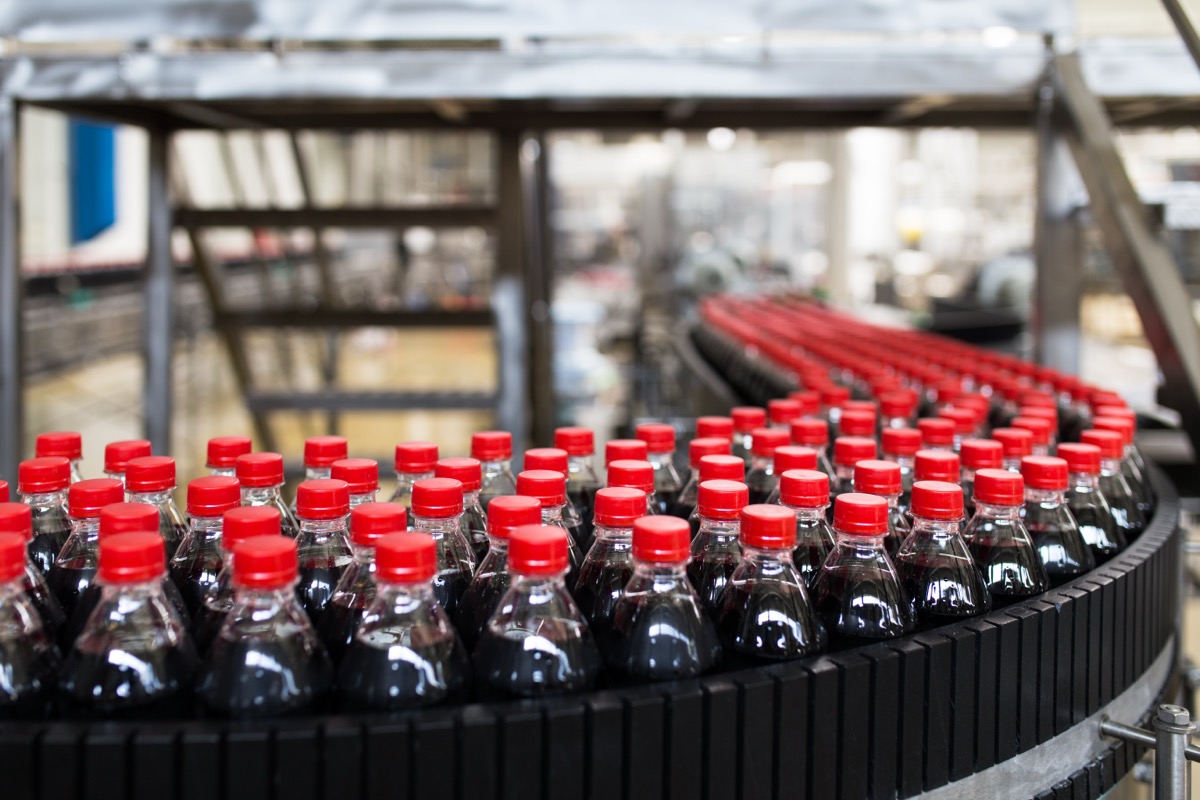 Bottling factory - Black juice or soft drink bottling line for processing and bottling juice into bottles