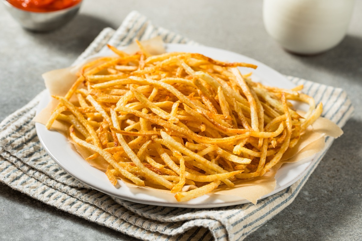 Homemade Shoesttring French Fries with Salt and Ketchup