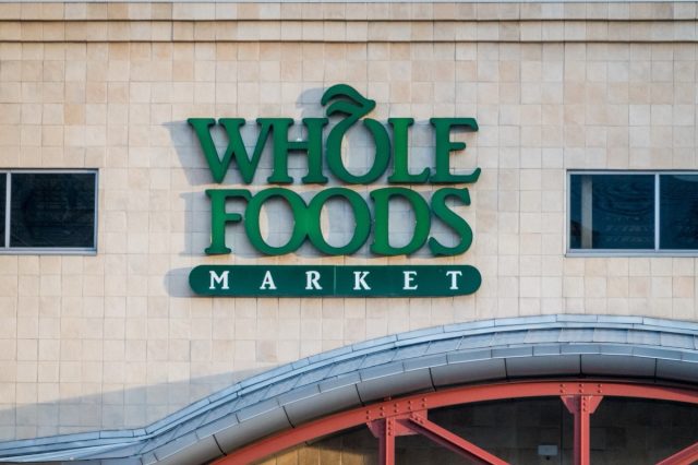 Denver, CO - May 15 2024: A sign for Whole Foods Market graces the facade of a building.