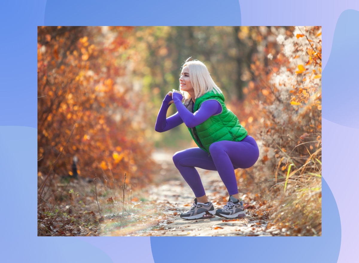 fit blonde woman doing squats outdoors