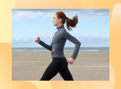 Woman power walking on the beach.