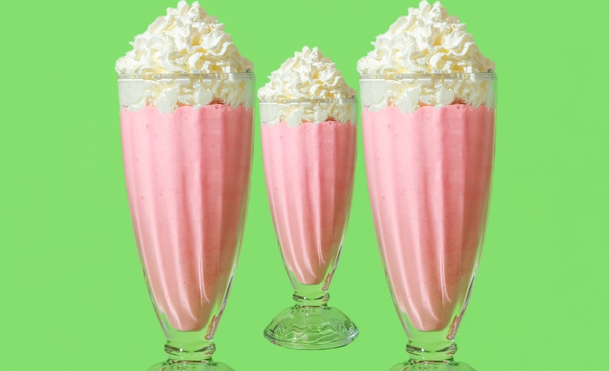 Close up,With,A,Glass,Of,Strawberries,Milkshake,Topped,With,Whipped