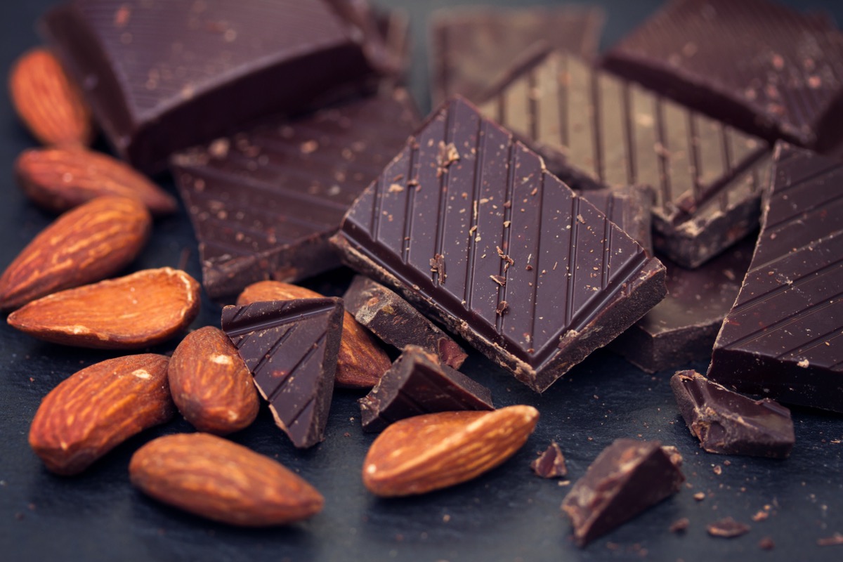 chocolate with almonds on black background