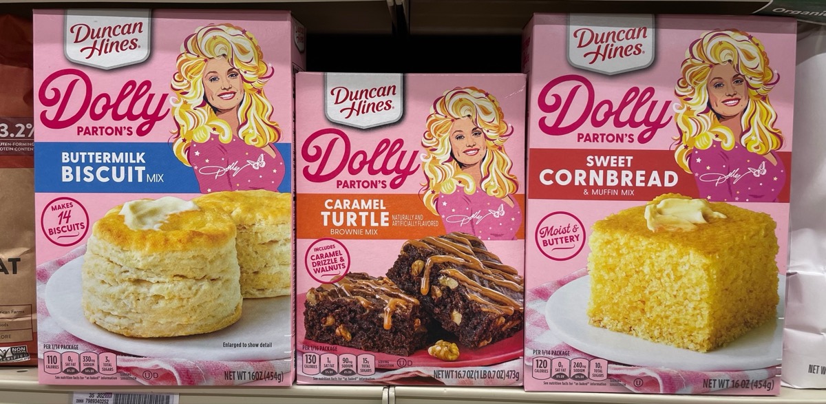 PLEASANT HILL, CA - SEPTEMBER 15: Boxes of Dolly Parton baking mixes, including buttermilk biscuit, caramel turtle and sweet cornbread on shelf at store. September 15, 2023, Concord, CA