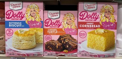 PLEASANT HILL, CA - SEPTEMBER 15: Boxes of Dolly Parton baking mixes, including buttermilk biscuit, caramel turtle and sweet cornbread on shelf at store. September 15, 2023, Concord, CA