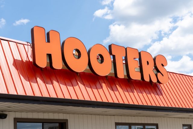 Mississauga, On, Canada - August 11, 2019: Close up of Hooters restaurant sign on the building in Mississauga, On, Canada. Hooters, Inc. is the trade name of two American restaurant chains.