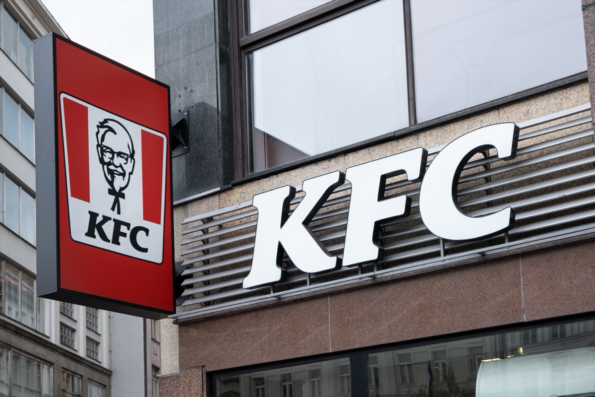 Prague,CZ - 10 October 2023: KFC sign board on restaurant in a historical building in Prague on street. Fast Food concept. EDITORIAL