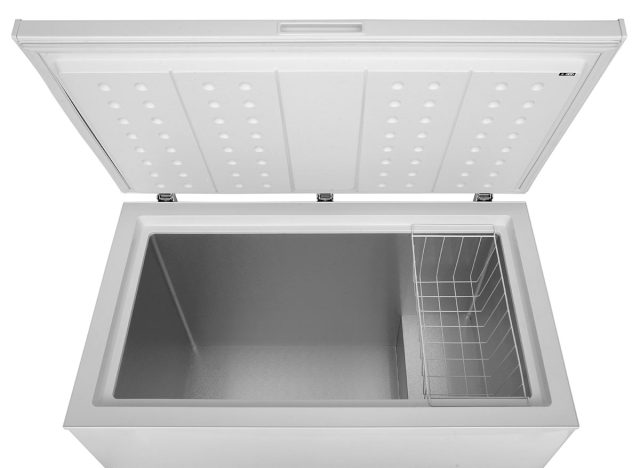 Open freezer on a white background, deep freeze