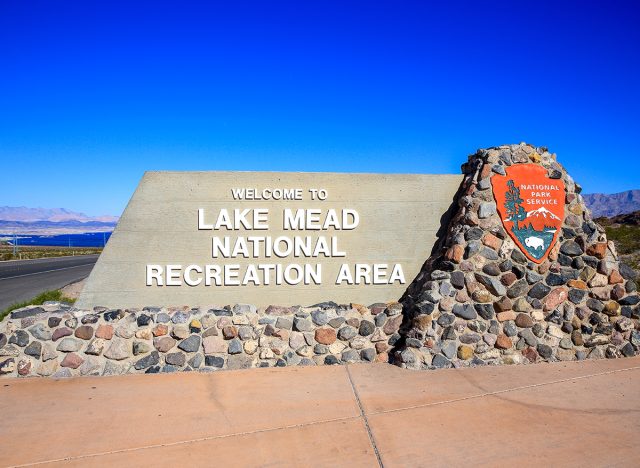 Boulder City, Nevada, USA - November 12, 2018 : U.S. Highway Route 93 Southbound Nevada Highway reminds motorists Welcome to Lake Mead National Recreation Area Entrance Sign.