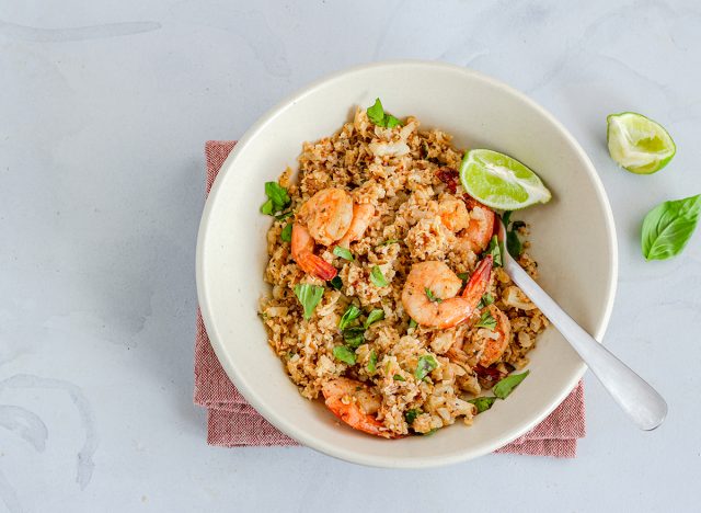 Cauliflower Shrimp Rice in a Bowl with Lemon and Basil, Top Down Photo