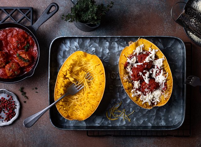 Cooking stuffed Spaghetti squash with meatballs in tomato sauce