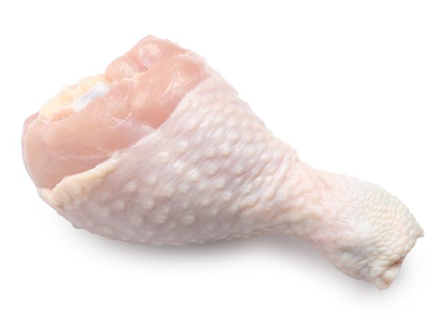 Raw chicken drumstick isolated on white. Fresh meat