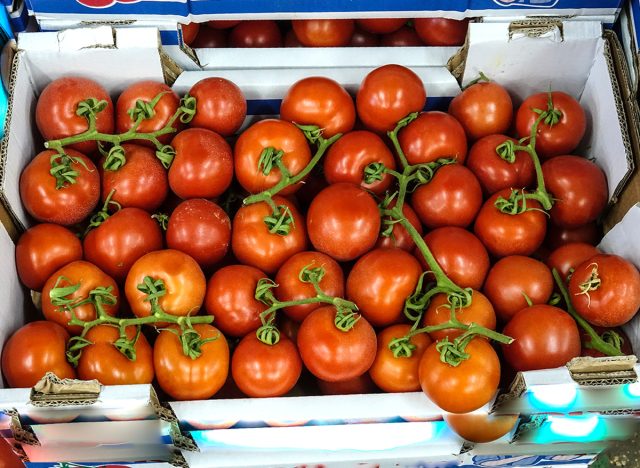 Fresh tomatoes bulk display at the market.