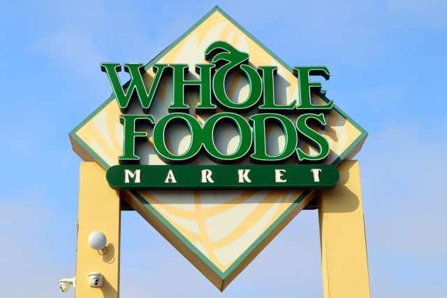 West Hollywood, California – July 9, 2024: Whole Foods Market sign, a subsidiary of Amazon, American multinational supermarket chain