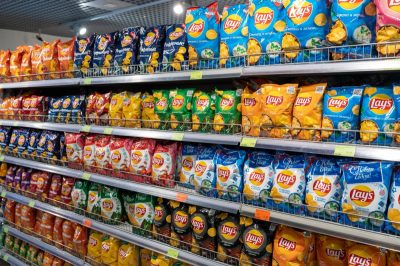 Various choice flavoured of lay's potato chips for sale in grocery store. Minsk, Belarus, 2023