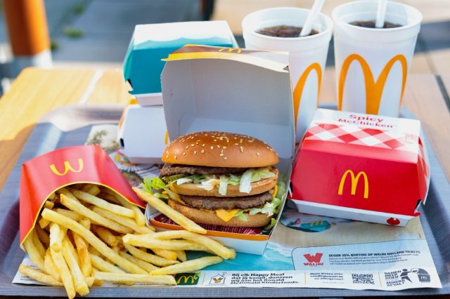 Amsterdam, Netherlands-June 5, 2024: fast Food set from McDonald's restaurant . Close up various burgers with French fries, cola drinks and sauces from McDonald's restaurant.