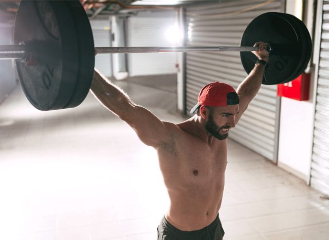 Man doing thrusters 