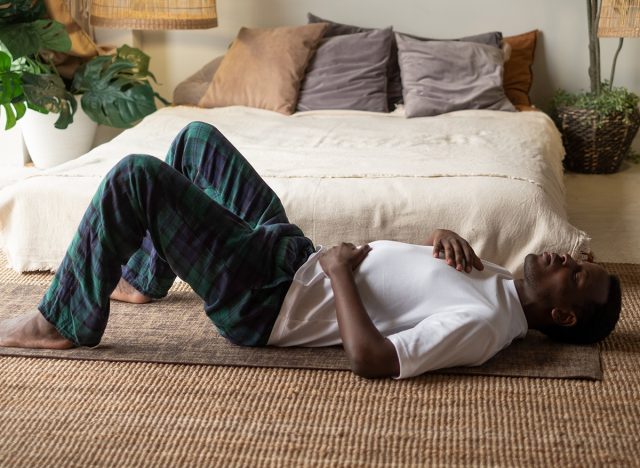 African adult man relax after working out breathing. Box Breathing.