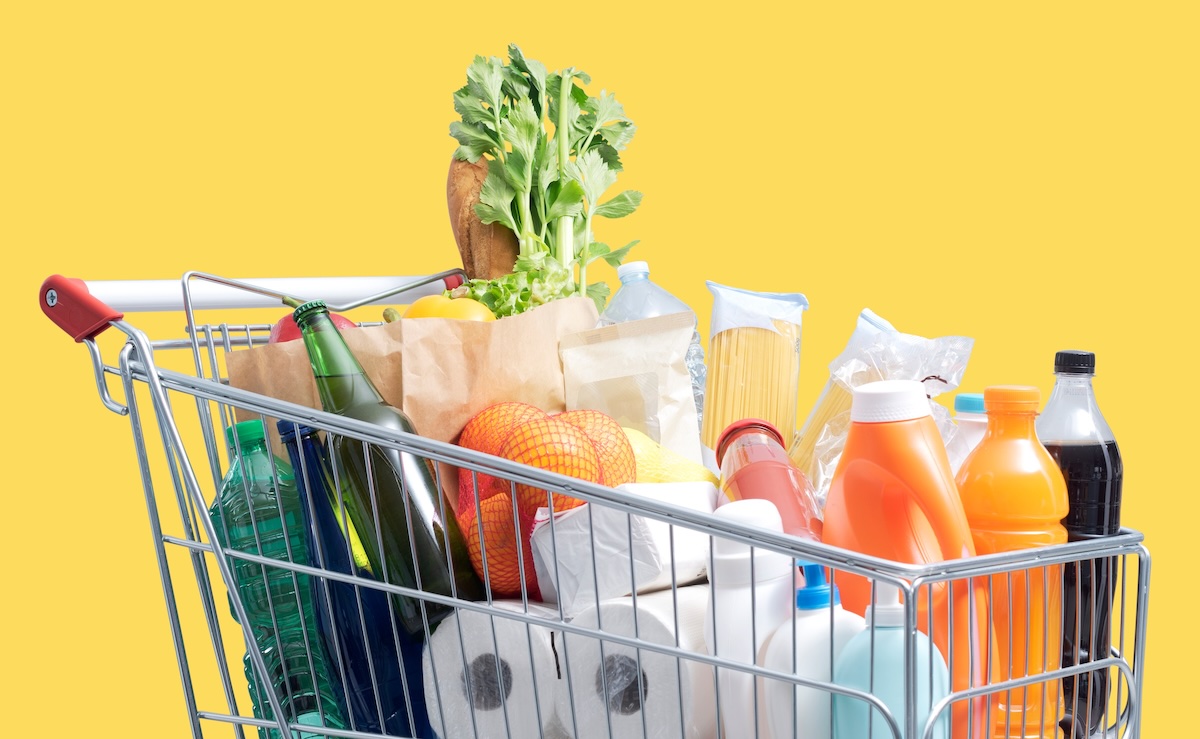 Shopping,Cart,Filled,With,Fresh,Goods,On,Yellow,Background,,Grocery