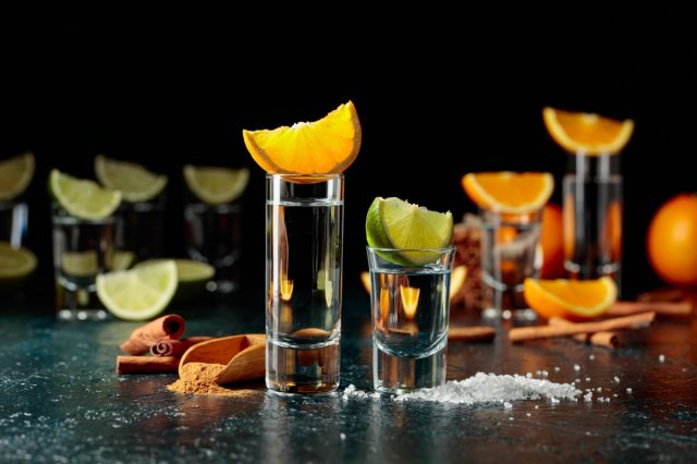 Tequila with lime and salt and tequila with orange and cinnamon.