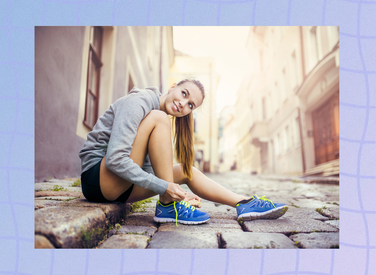 Woman tying shoes