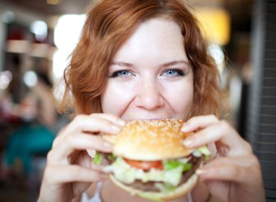 Woman eating burger